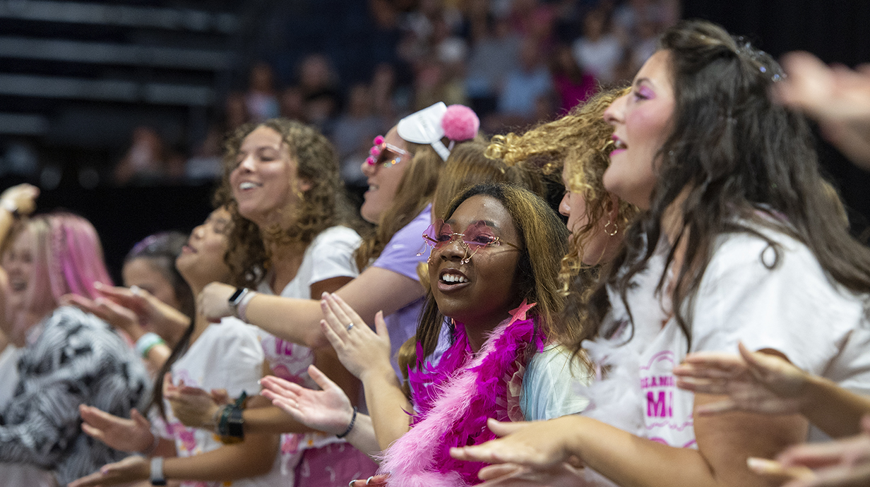 Sorority members perform on stage during Bid Day activities at the Pavilion.