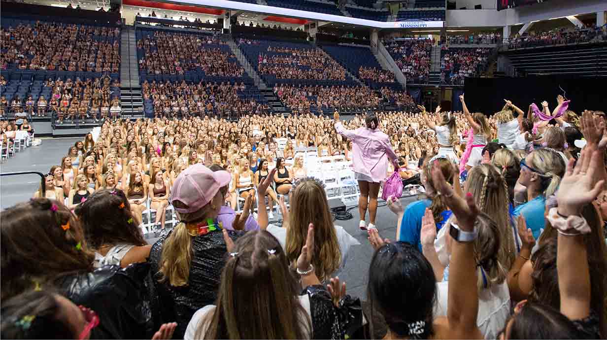 A group of sorority members performs on stage at The Pavilion during Bid Day activities.