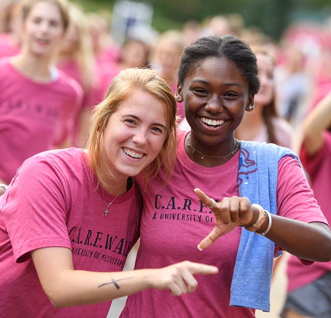 Sorority members walk through campus while participating in the CARE Walk in support of cancer research.