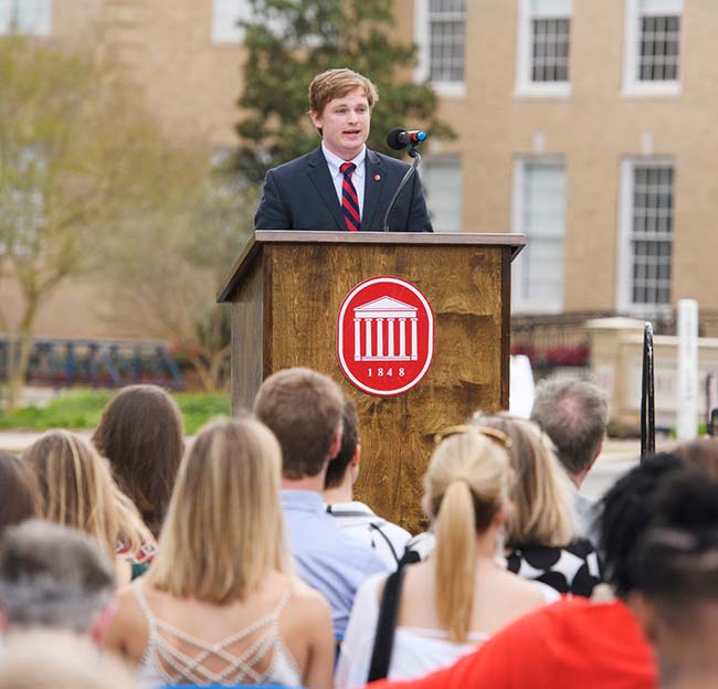 A member of the Associated Student Body speaks to the crowd at a public event.