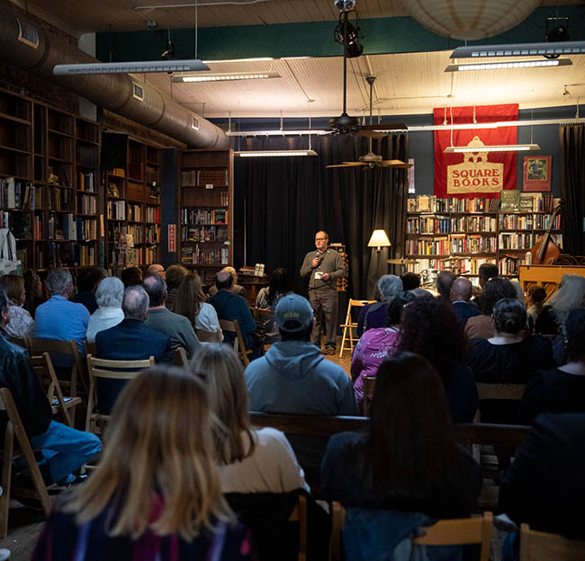 Ole Miss students and Oxford citizens attend a book signing and lecture at Off Square Books.