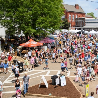 Thousands of attendees flood the Oxford Square during the Double Decker festival