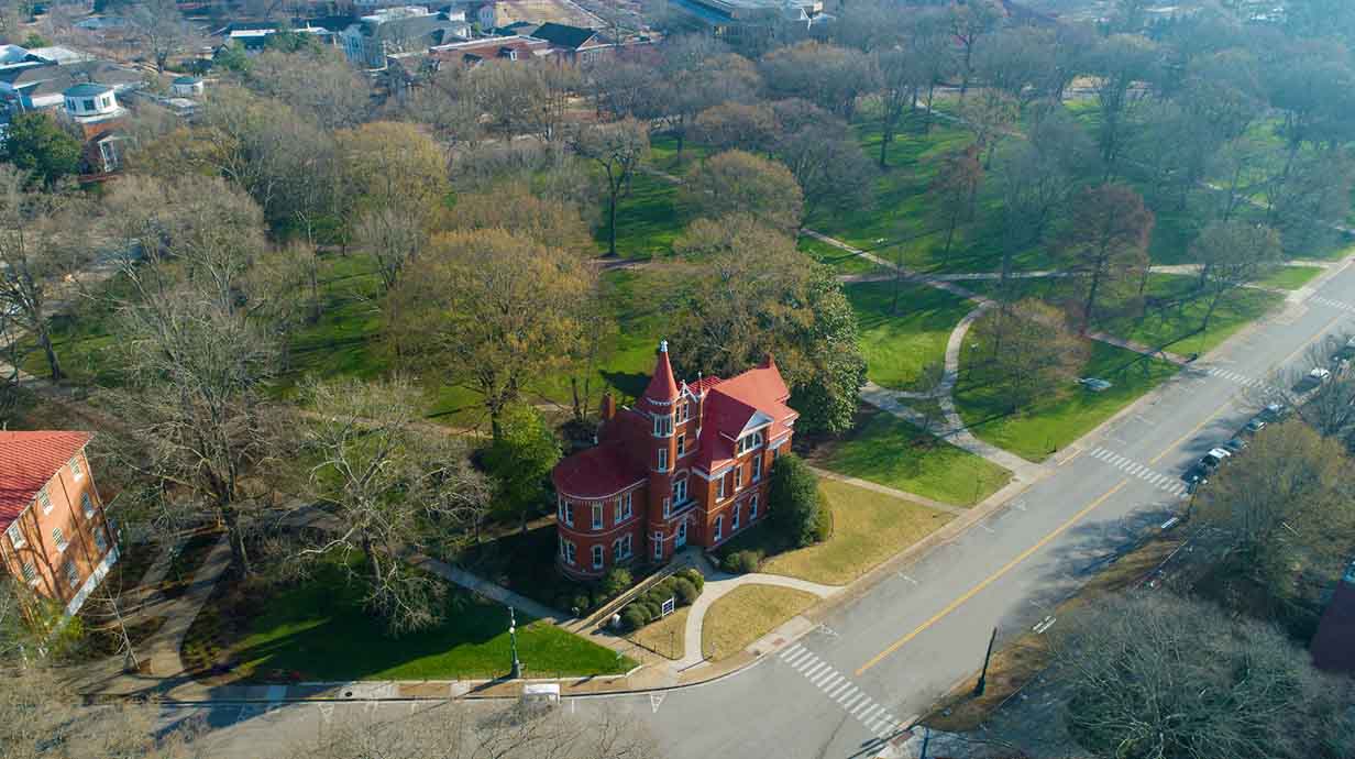 An aerial photo of Ventress Hall and the Grove on the Ole Miss campus.