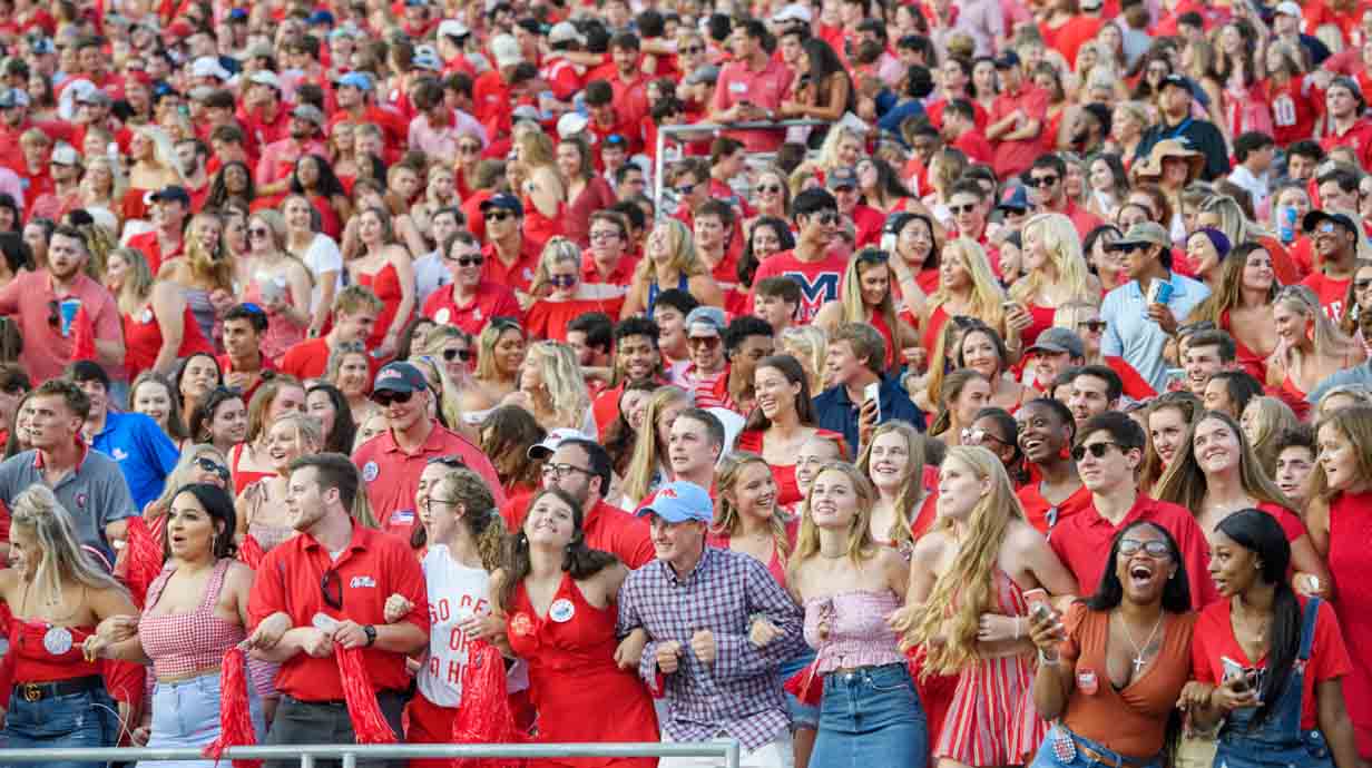 Students locking arms and swaying during a recent Arkansas vs. Ole Miss game.