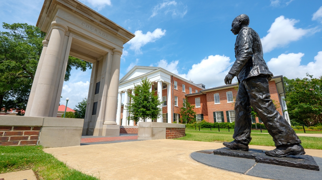 James Meredith's statue on campus during a sunny day.