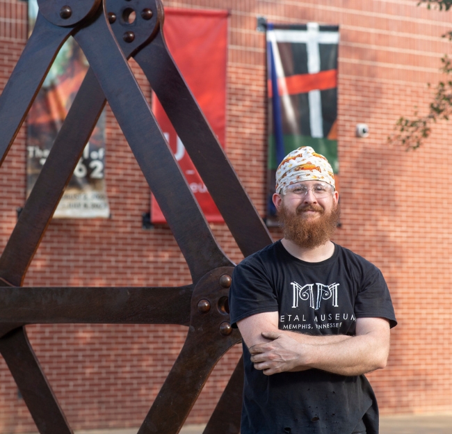 Ian Skinner, an alumni of MFA, Sculpture – 2020, installs his new piece, “Span” at University of Mississippi Museum on Thursday, March 23, 2023.