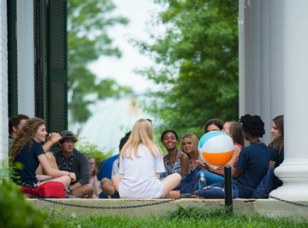 Ole Miss students sitting in front of the Lyceum.